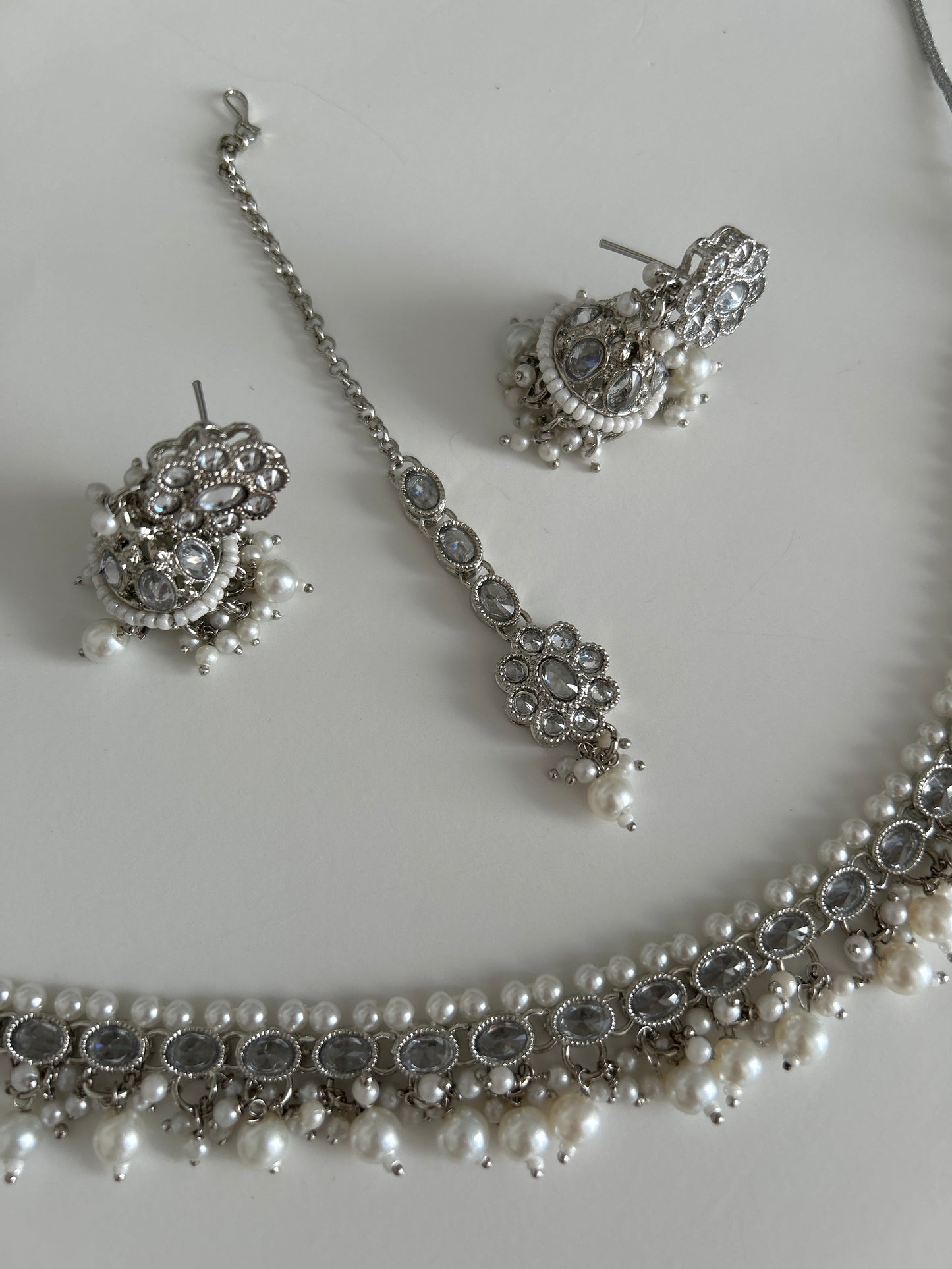 Silver oval necklace earrings tikka set