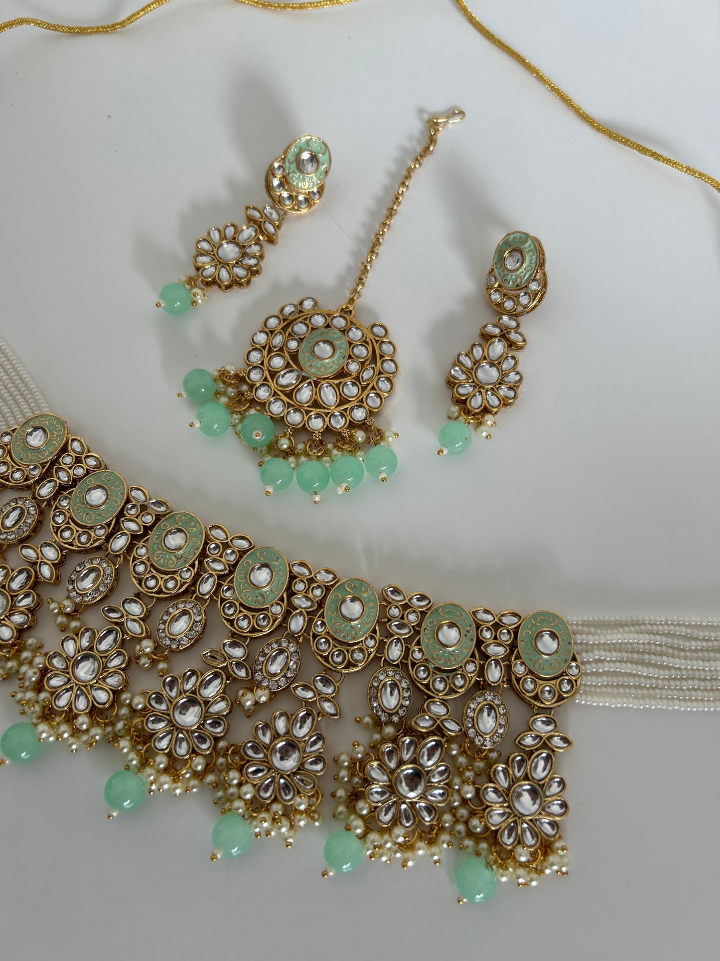 Green crystal necklace earrings tikka set