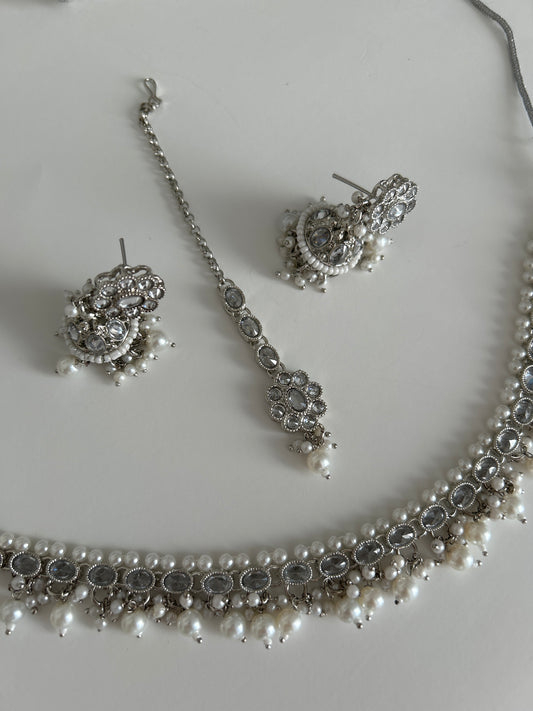 Silver oval necklace earrings tikka set